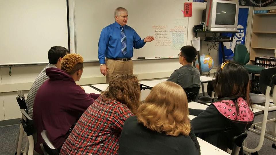 Dave Larson speaking with high school students