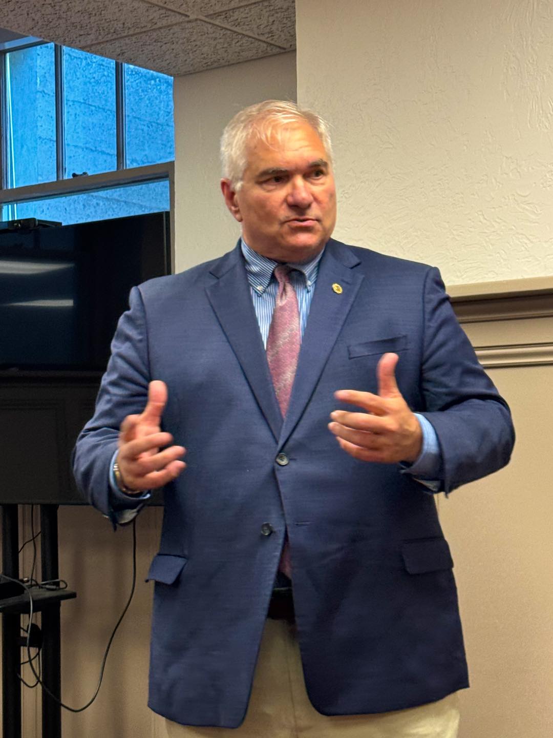 Judge Dave Larson speaking passionately at a community event